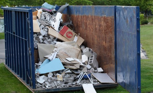 Builders managing construction waste in Stratford